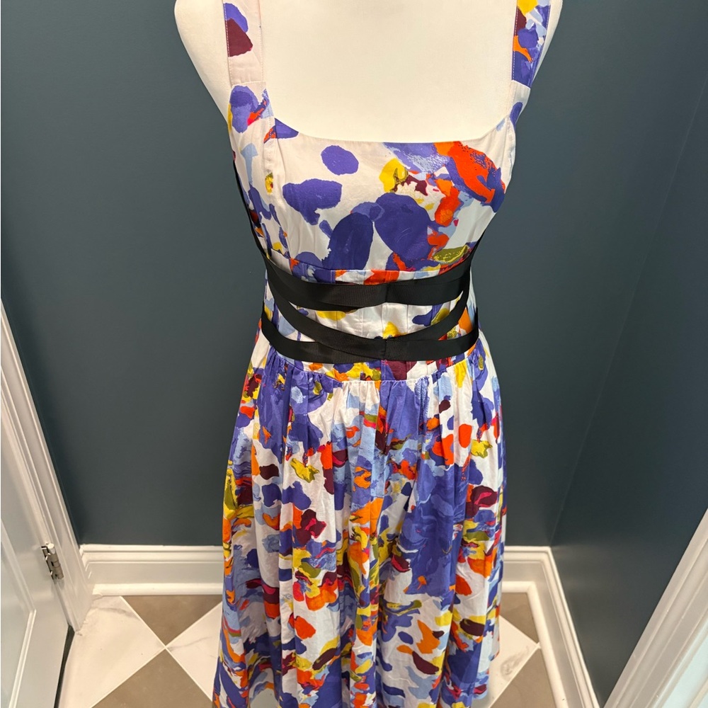 Maeve cotton sundress with black ribbon details.